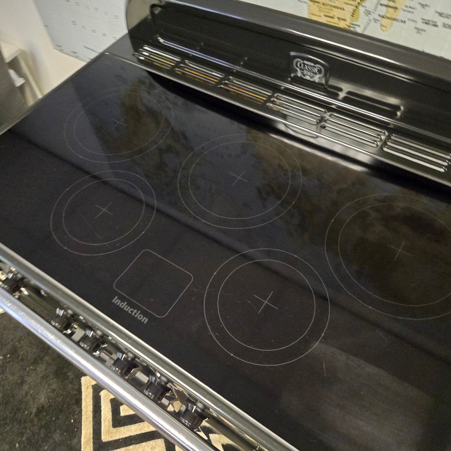 Rangemaster Classic Deluxe Induction Range Cooker in Black with a Chrome Trim 100cm