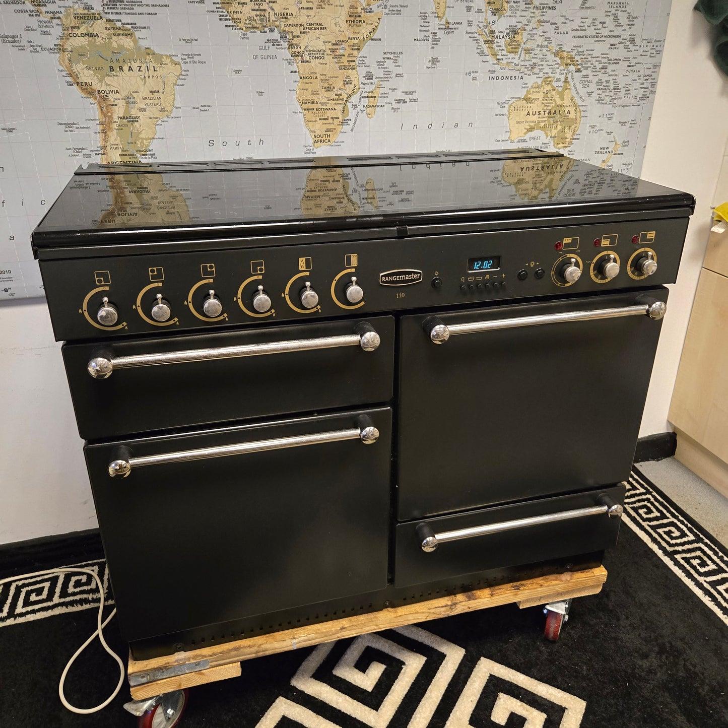 Rangemaster 110 Dual Fuel Range Cooker in Black 110cm with a Lid / Splashback